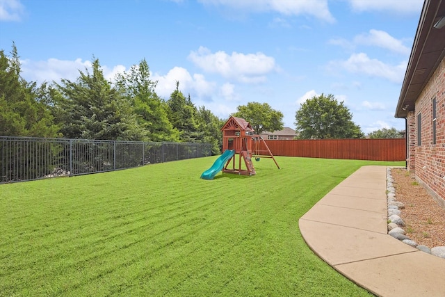 view of jungle gym with a lawn