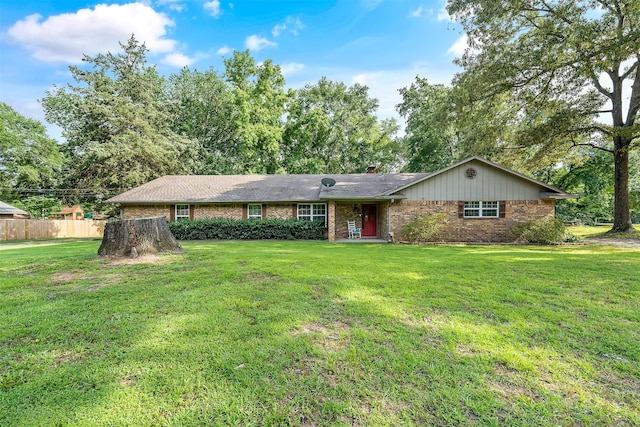 ranch-style house featuring a front lawn