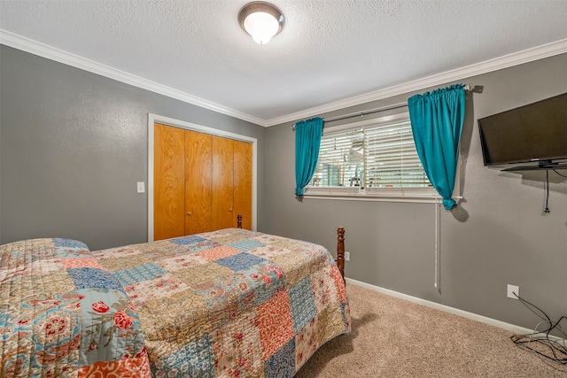 carpeted bedroom with crown molding, a textured ceiling, and a closet