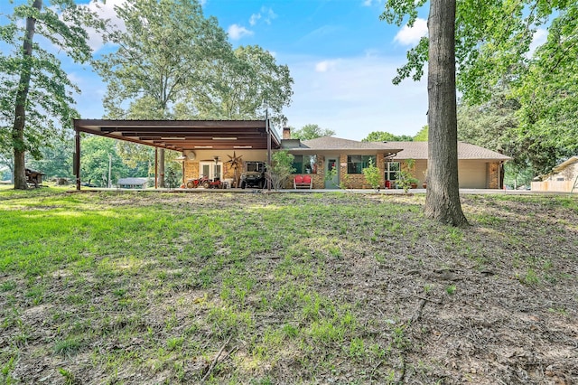 ranch-style home featuring a front yard