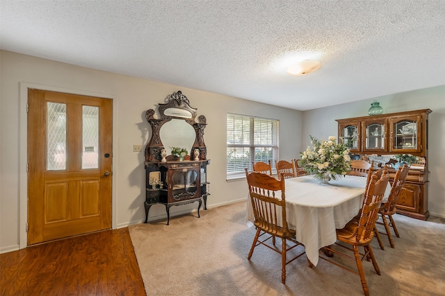 dining space featuring a textured ceiling