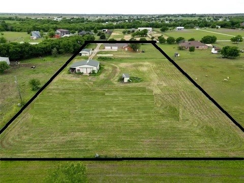 birds eye view of property featuring a rural view