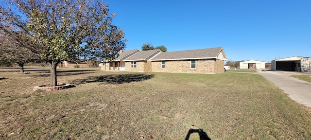 view of home's exterior featuring an outbuilding and a yard