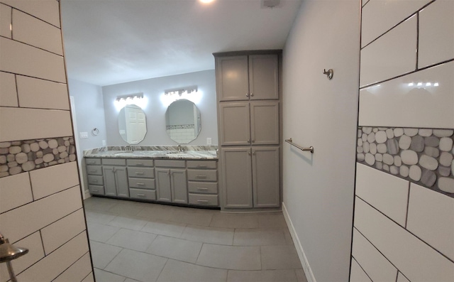 bathroom with tile patterned floors and vanity