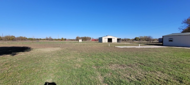 view of yard with a rural view