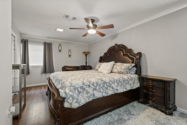 bedroom featuring wood-type flooring, ceiling fan, and crown molding