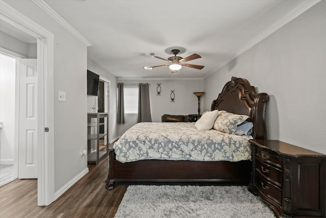 bedroom featuring dark hardwood / wood-style floors, ceiling fan, and crown molding