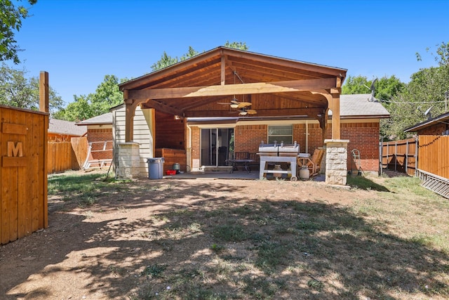 rear view of house with outdoor lounge area, ceiling fan, and a patio area