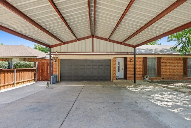 exterior space with a carport and a garage