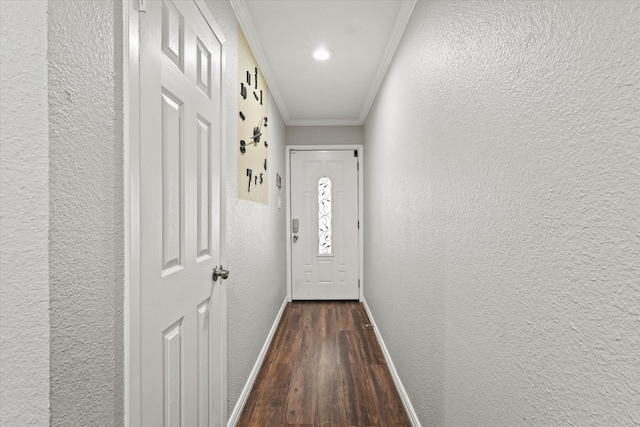 doorway to outside with dark hardwood / wood-style floors and crown molding