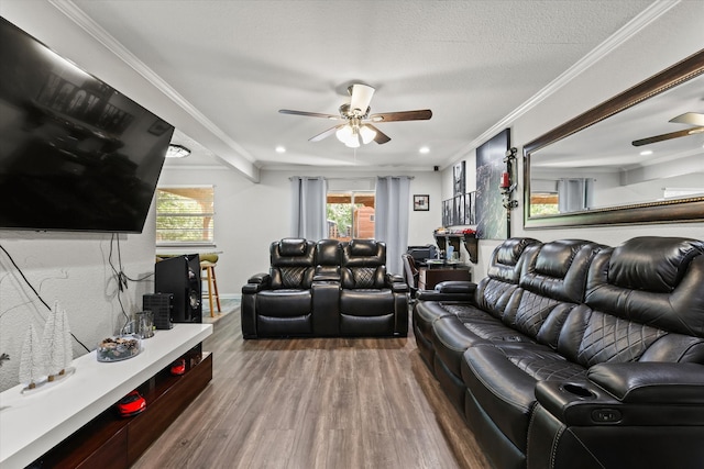 living room featuring a textured ceiling, hardwood / wood-style flooring, ceiling fan, and crown molding