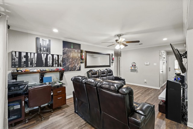 cinema with ceiling fan, ornamental molding, and hardwood / wood-style flooring