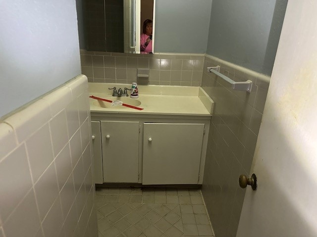 bathroom featuring vanity, tile walls, and tile patterned floors