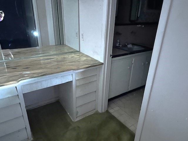 kitchen with tile patterned flooring and sink