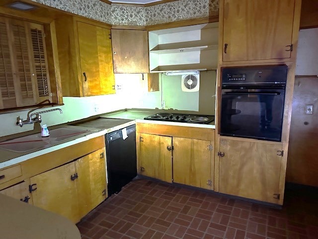 kitchen featuring sink and black appliances