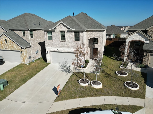 french provincial home featuring a garage and a front lawn