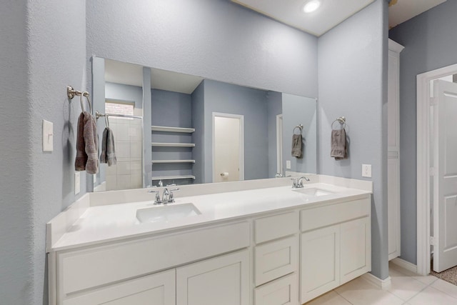 bathroom featuring tile patterned floors and vanity