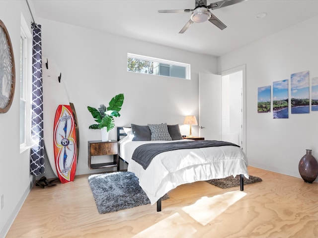 bedroom with light wood-type flooring and ceiling fan