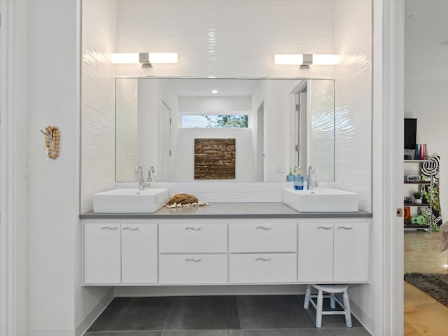 bathroom with vanity and tile patterned flooring