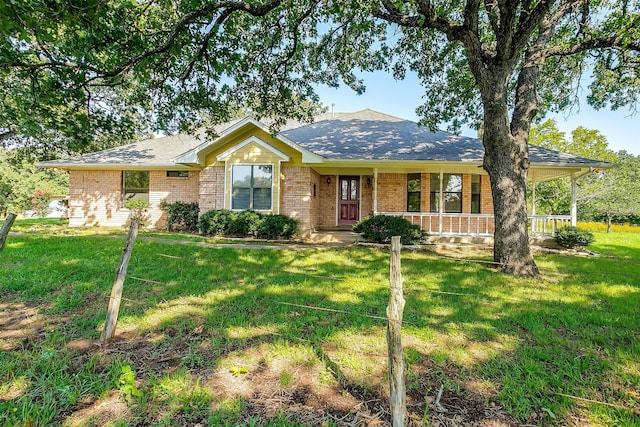 single story home featuring a front lawn and a porch