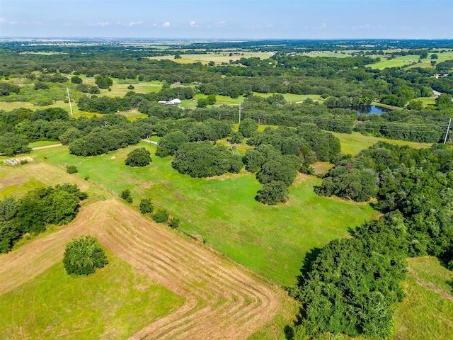 birds eye view of property with a rural view and a water view