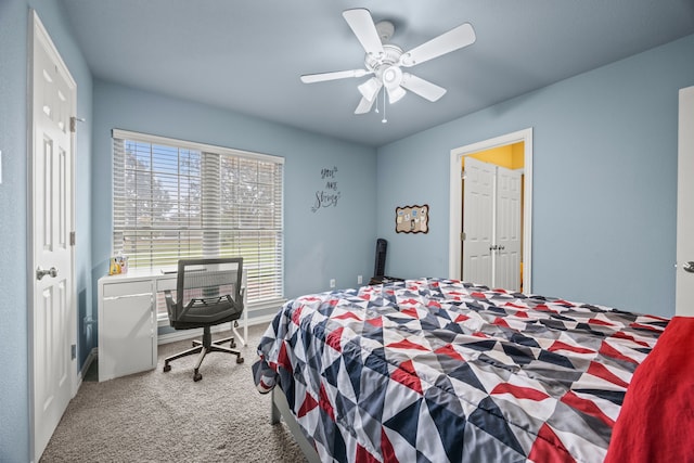 carpeted bedroom with ceiling fan