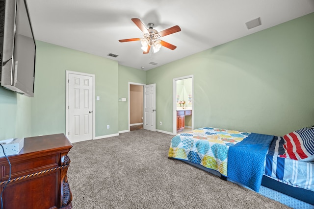 carpeted bedroom with ceiling fan and ensuite bathroom