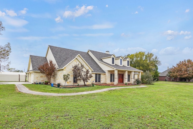 cape cod-style house with a front yard and a garage