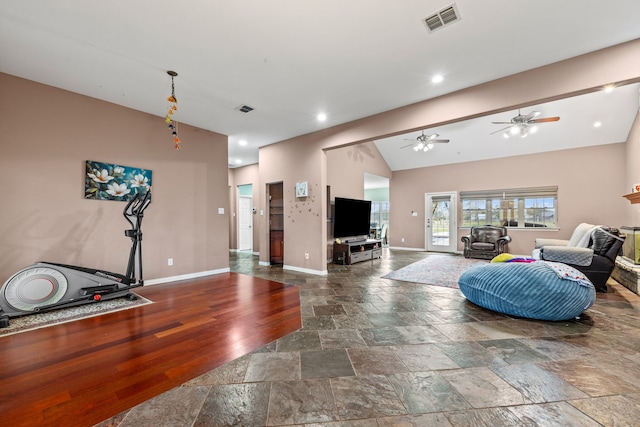 living room with ceiling fan and lofted ceiling