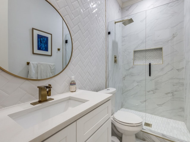 bathroom with backsplash, an enclosed shower, vanity, tile walls, and toilet