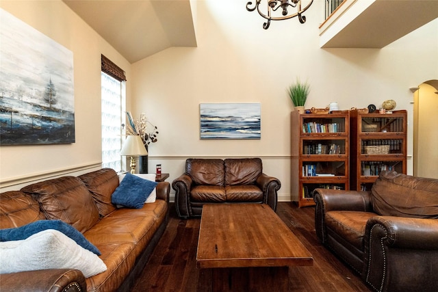 living area with dark wood-type flooring and vaulted ceiling