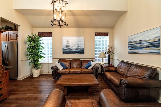 living room with dark wood-style floors, vaulted ceiling, and a wealth of natural light