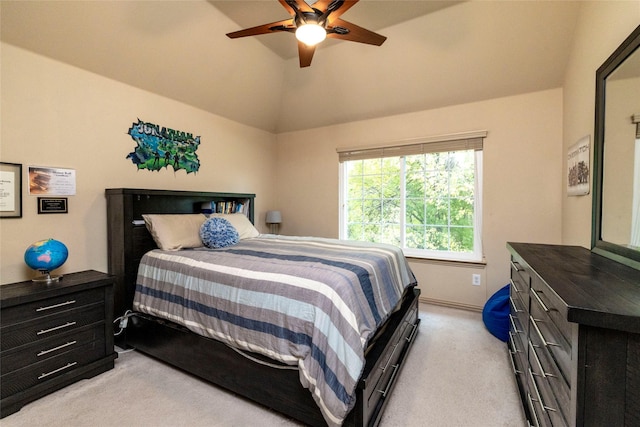 carpeted bedroom featuring ceiling fan and high vaulted ceiling