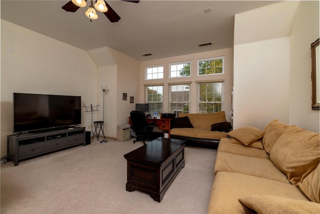 living room with a ceiling fan, light colored carpet, and visible vents