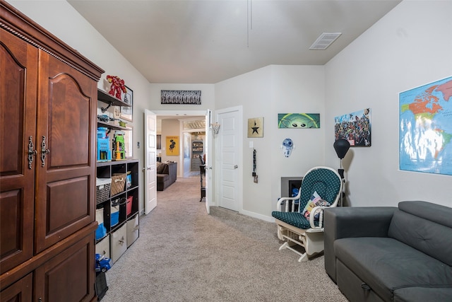 sitting room featuring light carpet