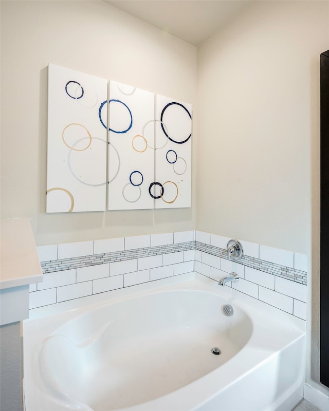 bathroom with vanity and a tub to relax in