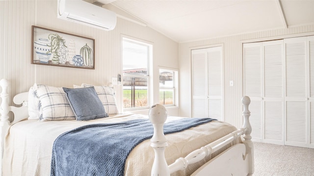 bedroom with carpet, a wall mounted air conditioner, lofted ceiling, and two closets