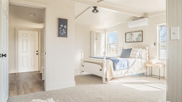 carpeted bedroom featuring vaulted ceiling with beams, a wall mounted AC, and baseboards