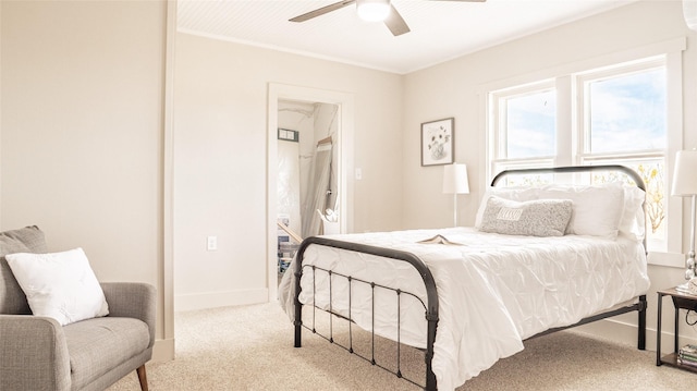 bedroom with a ceiling fan, baseboards, carpet flooring, and ornamental molding