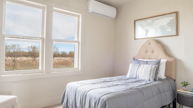 bedroom with an AC wall unit