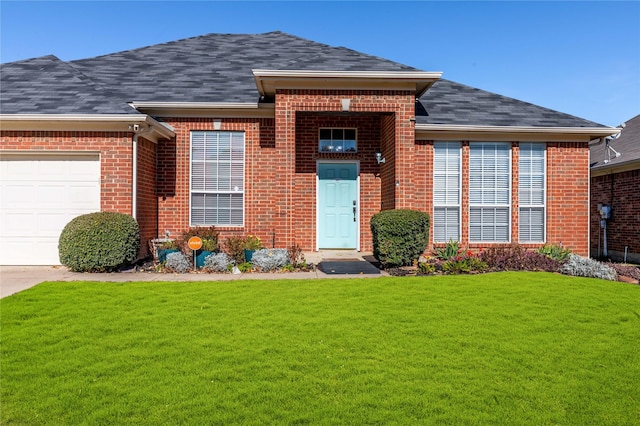 view of front facade with a garage and a front lawn