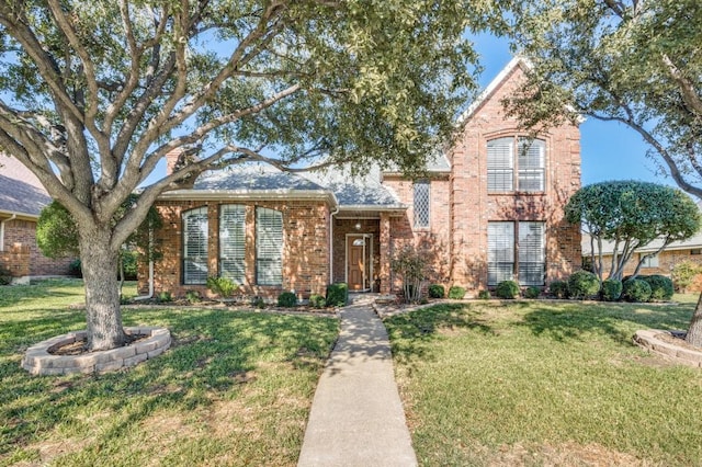 view of front of home with a front lawn