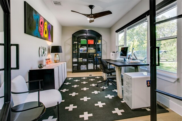 office space with ceiling fan and dark wood-type flooring