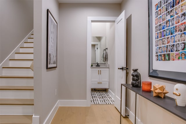 interior space featuring sink and light wood-type flooring