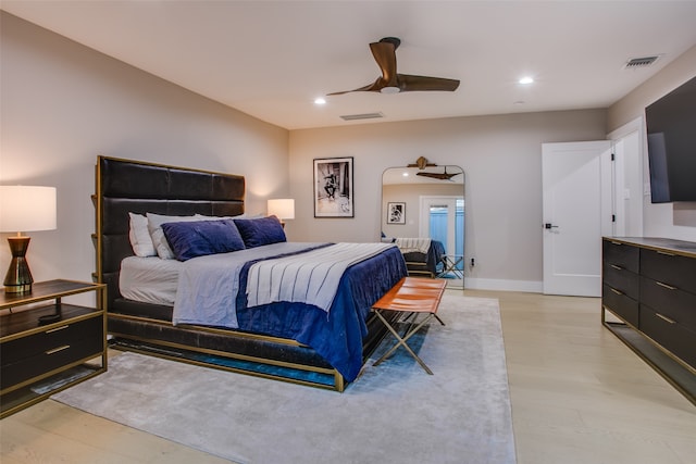 bedroom with ceiling fan and light wood-type flooring