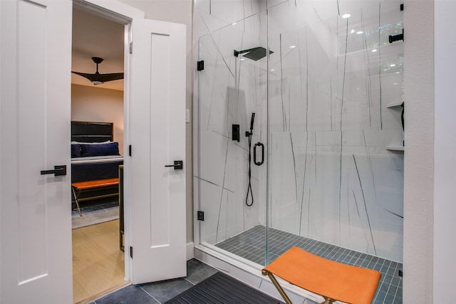 bathroom featuring tile patterned floors and a shower with shower door