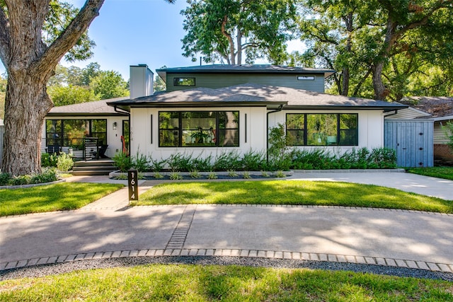 view of front of house with a front lawn and a porch