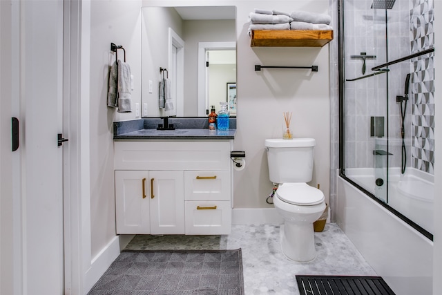 full bathroom featuring shower / bath combination with glass door, tile patterned floors, vanity, and toilet