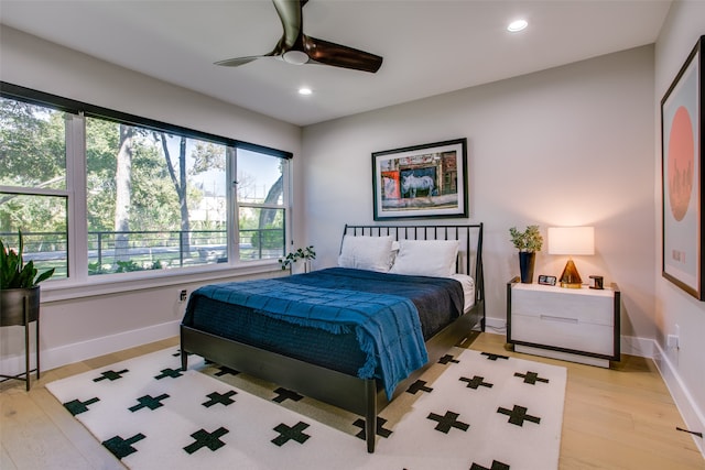 bedroom featuring light hardwood / wood-style flooring and ceiling fan