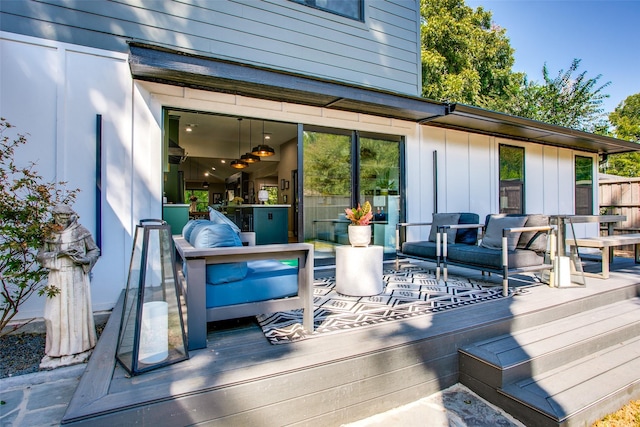 wooden terrace featuring an outdoor living space